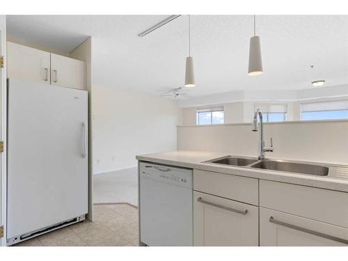 3153-1818 Simcoe Boulevard Sw, Calgary, AB - Indoor Photo Showing Kitchen With Double Sink