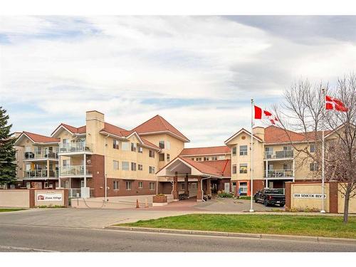 3153-1818 Simcoe Boulevard Sw, Calgary, AB - Outdoor With Balcony With Facade