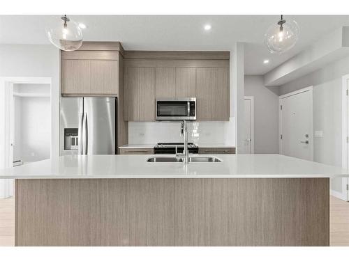 4413-111 Wolf Creek Drive Se, Calgary, AB - Indoor Photo Showing Kitchen With Double Sink With Upgraded Kitchen