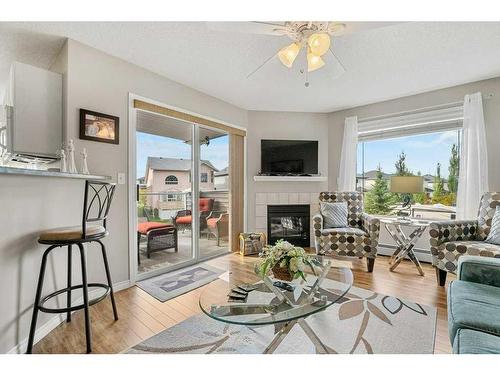 2202 Tuscarora Manor Nw, Calgary, AB - Indoor Photo Showing Living Room With Fireplace