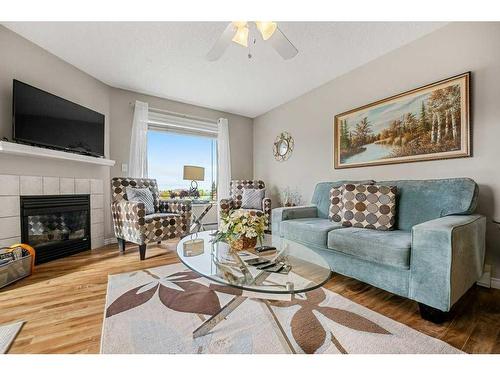 2202 Tuscarora Manor Nw, Calgary, AB - Indoor Photo Showing Living Room With Fireplace