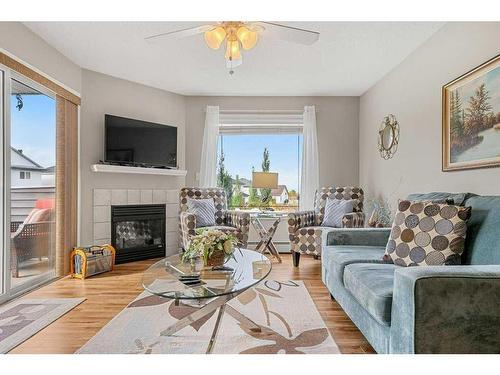 2202 Tuscarora Manor Nw, Calgary, AB - Indoor Photo Showing Living Room With Fireplace