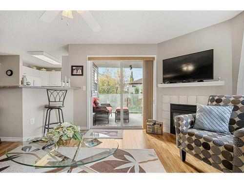 2202 Tuscarora Manor Nw, Calgary, AB - Indoor Photo Showing Living Room With Fireplace