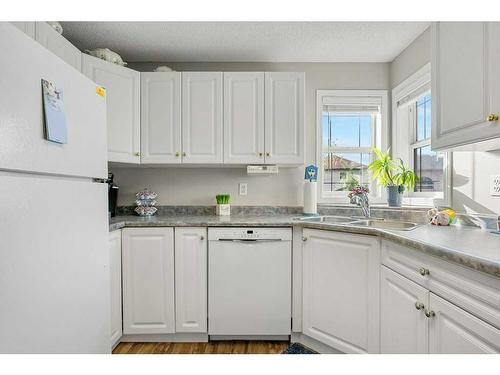 2202 Tuscarora Manor Nw, Calgary, AB - Indoor Photo Showing Kitchen With Double Sink