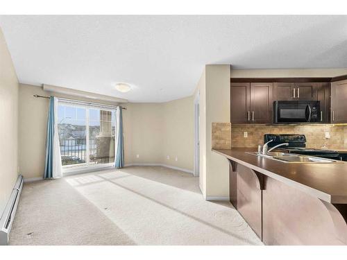 1207-130 Panatella Street Nw, Calgary, AB - Indoor Photo Showing Kitchen With Double Sink