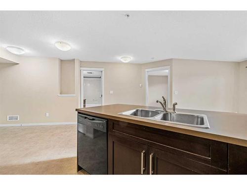 1207-130 Panatella Street Nw, Calgary, AB - Indoor Photo Showing Kitchen With Double Sink