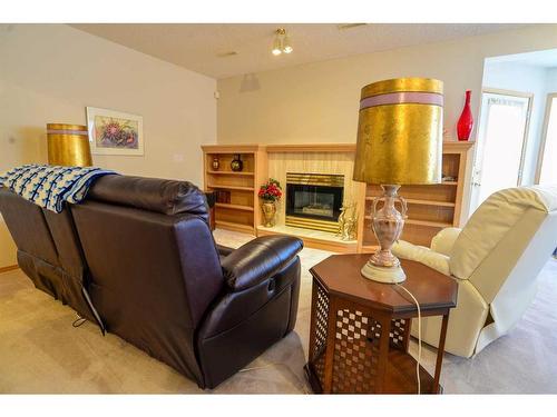 116 Hamptons Park Nw, Calgary, AB - Indoor Photo Showing Living Room With Fireplace