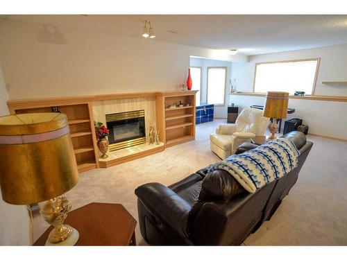 116 Hamptons Park Nw, Calgary, AB - Indoor Photo Showing Living Room With Fireplace