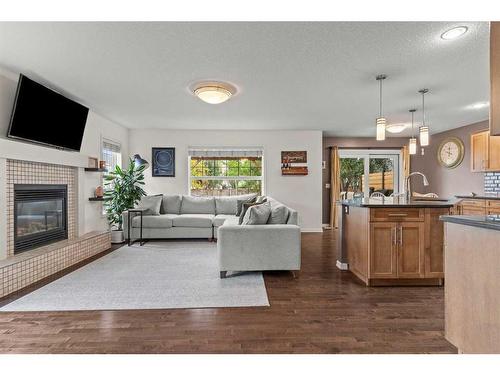 310 Autumn Circle Se, Calgary, AB - Indoor Photo Showing Living Room With Fireplace