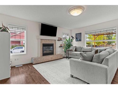 310 Autumn Circle Se, Calgary, AB - Indoor Photo Showing Living Room With Fireplace