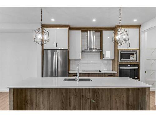 230 Kinniburgh Loop, Chestermere, AB - Indoor Photo Showing Kitchen With Double Sink With Upgraded Kitchen