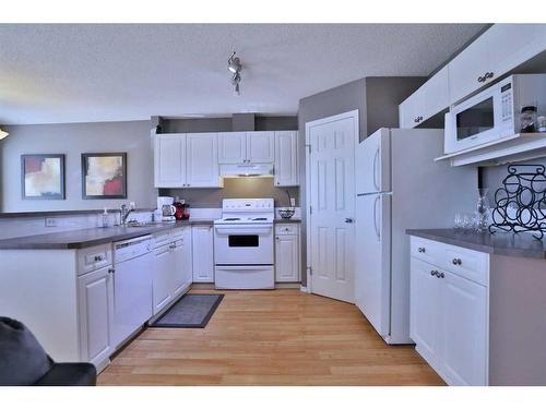 144 Hidden Creek Rise Nw, Calgary, AB - Indoor Photo Showing Kitchen With Double Sink