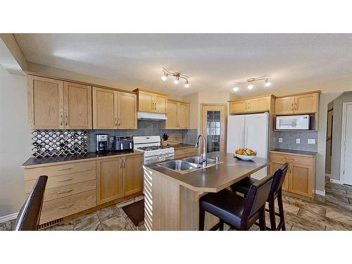 9 Prairie Springs Close Sw, Airdrie, AB - Indoor Photo Showing Kitchen With Double Sink