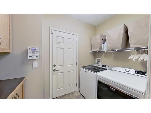 9 Prairie Springs Close Sw, Airdrie, AB - Indoor Photo Showing Laundry Room