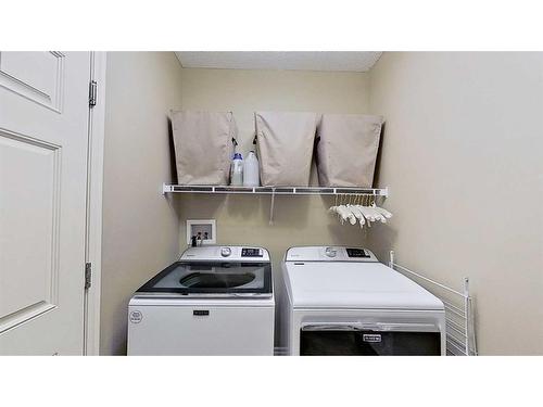 9 Prairie Springs Close Sw, Airdrie, AB - Indoor Photo Showing Laundry Room