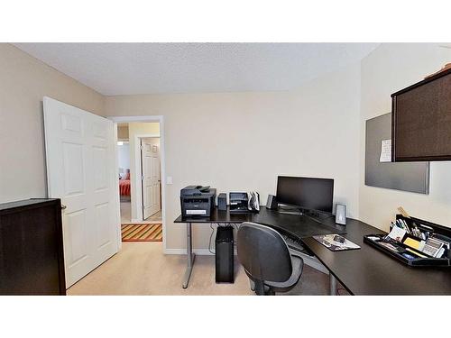 9 Prairie Springs Close Sw, Airdrie, AB - Indoor Photo Showing Office