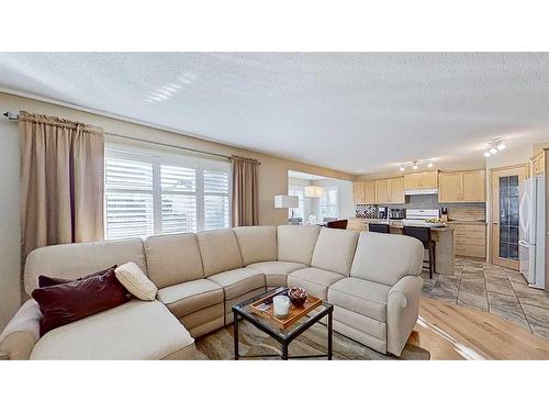 9 Prairie Springs Close Sw, Airdrie, AB - Indoor Photo Showing Living Room