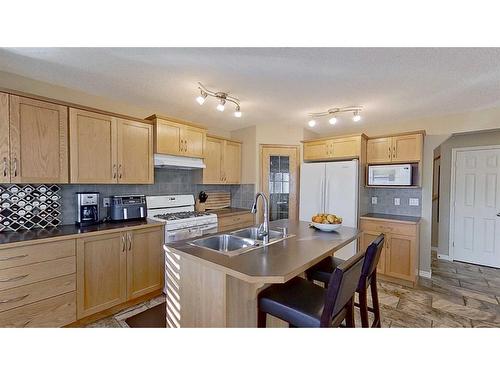 9 Prairie Springs Close Sw, Airdrie, AB - Indoor Photo Showing Kitchen With Double Sink