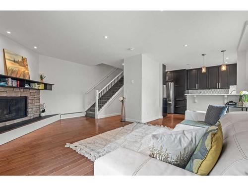 A-2115 35 Avenue Sw, Calgary, AB - Indoor Photo Showing Living Room With Fireplace