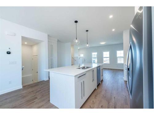 54 Dawson Drive, Chestermere, AB - Indoor Photo Showing Kitchen With Double Sink With Upgraded Kitchen