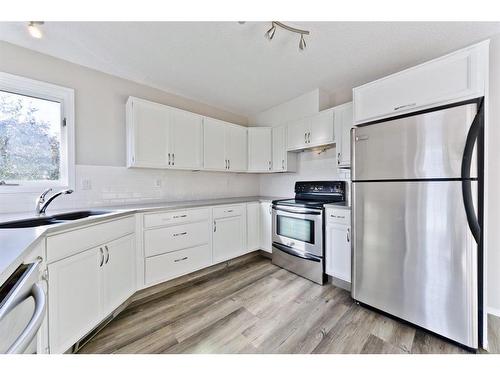 188 Silvergrove Way Nw, Calgary, AB - Indoor Photo Showing Kitchen With Double Sink