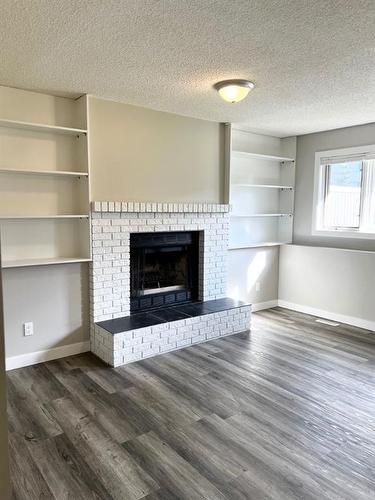 188 Silvergrove Way Nw, Calgary, AB - Indoor Photo Showing Living Room With Fireplace