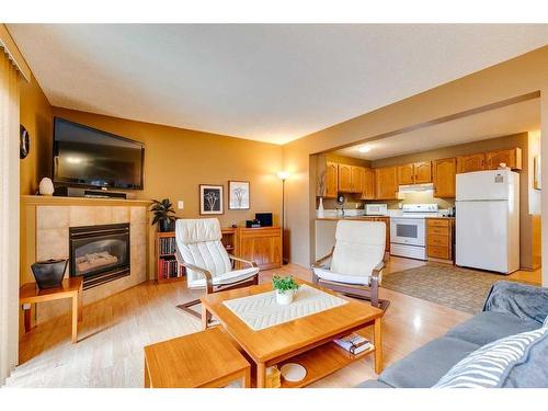 151 Somervale Park Sw, Calgary, AB - Indoor Photo Showing Living Room With Fireplace