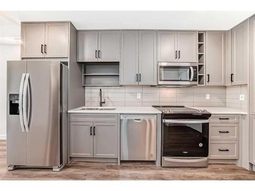 3211-350 Livingston Common Ne, Calgary, AB - Indoor Photo Showing Kitchen With Stainless Steel Kitchen With Double Sink With Upgraded Kitchen