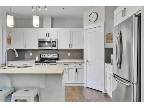 206-20 Walgrove Walk Se, Calgary, AB - Indoor Photo Showing Kitchen With Stainless Steel Kitchen With Upgraded Kitchen