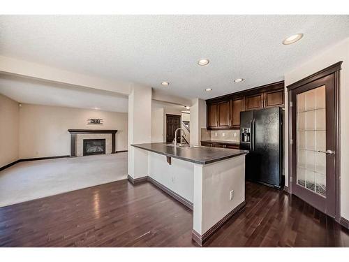 16 Kincora Hill Nw, Calgary, AB - Indoor Photo Showing Kitchen With Fireplace