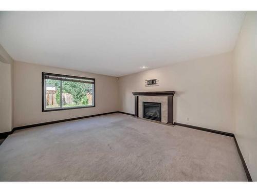 16 Kincora Hill Nw, Calgary, AB - Indoor Photo Showing Living Room With Fireplace