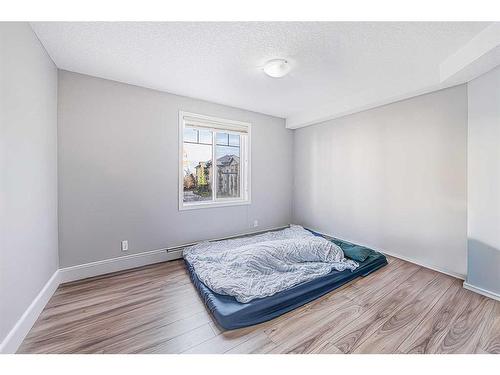 1304-8810 Royal Birch Boulevard Nw, Calgary, AB - Indoor Photo Showing Bedroom