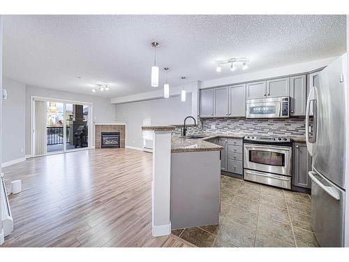 1304-8810 Royal Birch Boulevard Nw, Calgary, AB - Indoor Photo Showing Kitchen With Upgraded Kitchen