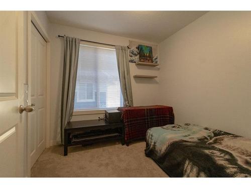 2206 Jumping Pound Common, Cochrane, AB - Indoor Photo Showing Bedroom