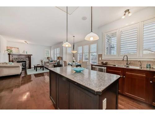 11 Crestridge Way Sw, Calgary, AB - Indoor Photo Showing Other Room With Fireplace