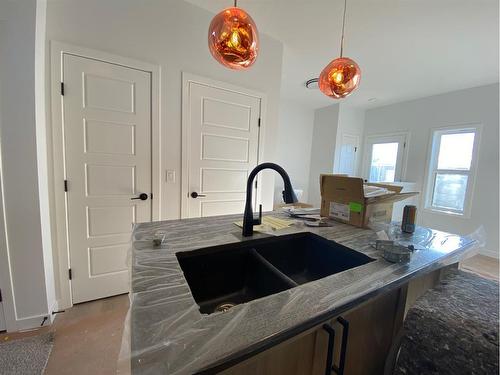 125 Ellen Close, Crossfield, AB - Indoor Photo Showing Kitchen With Double Sink