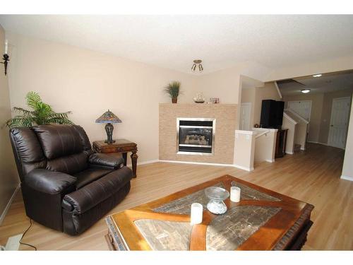 5343 Copperfield Gate Se, Calgary, AB - Indoor Photo Showing Living Room With Fireplace