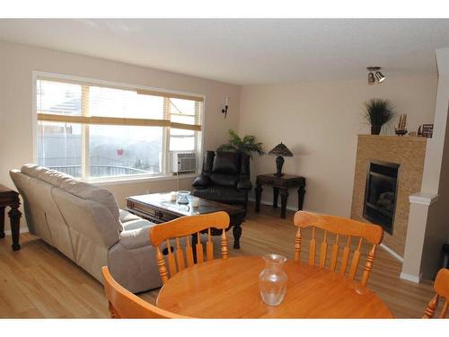 5343 Copperfield Gate Se, Calgary, AB - Indoor Photo Showing Living Room With Fireplace