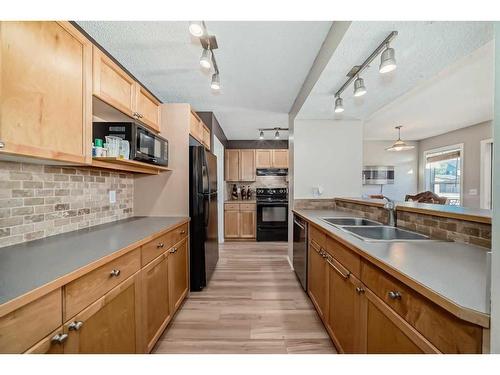 5343 Copperfield Gate Se, Calgary, AB - Indoor Photo Showing Kitchen With Double Sink