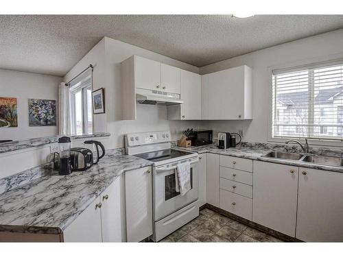 402-2000 Somervale Court Sw, Calgary, AB - Indoor Photo Showing Kitchen With Double Sink