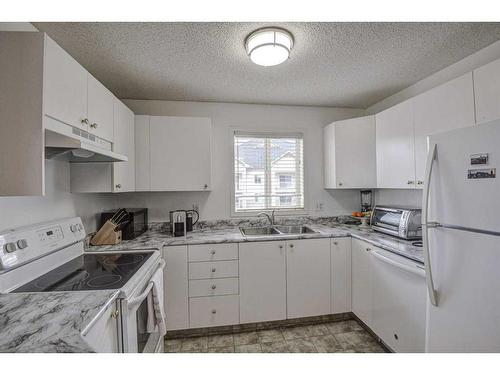 402-2000 Somervale Court Sw, Calgary, AB - Indoor Photo Showing Kitchen With Double Sink