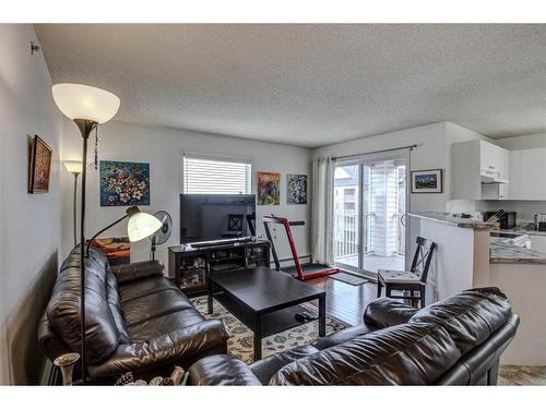 402-2000 Somervale Court Sw, Calgary, AB - Indoor Photo Showing Living Room