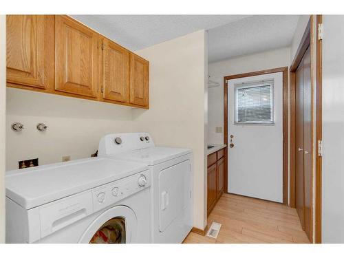 83 Deerbrook Road Se, Calgary, AB - Indoor Photo Showing Laundry Room