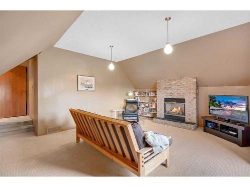 83 Deerbrook Road Se, Calgary, AB - Indoor With Fireplace