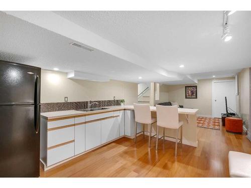 83 Deerbrook Road Se, Calgary, AB - Indoor Photo Showing Kitchen With Double Sink