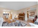 83 Deerbrook Road Se, Calgary, AB  - Indoor Photo Showing Living Room 