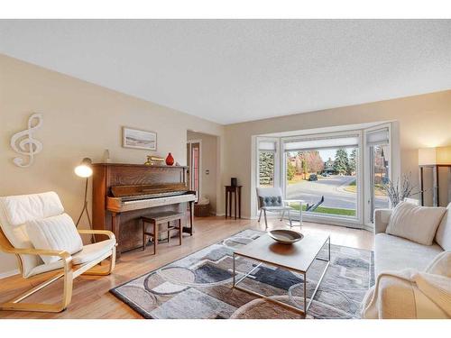 83 Deerbrook Road Se, Calgary, AB - Indoor Photo Showing Living Room