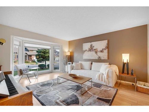 83 Deerbrook Road Se, Calgary, AB - Indoor Photo Showing Living Room