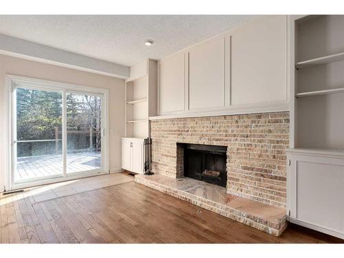 124 Ranch Estates Drive Nw, Calgary, AB - Indoor Photo Showing Living Room With Fireplace