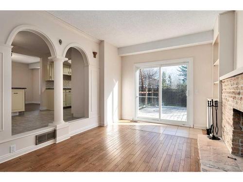 124 Ranch Estates Drive Nw, Calgary, AB - Indoor Photo Showing Other Room With Fireplace